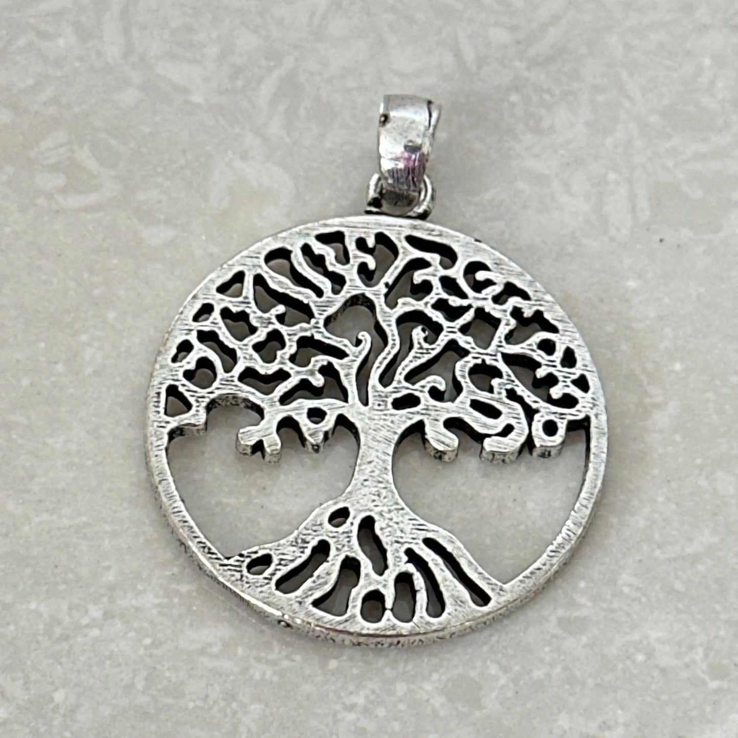 Tree of Life pendant symbolizing growth and harmony - Uplift Beads