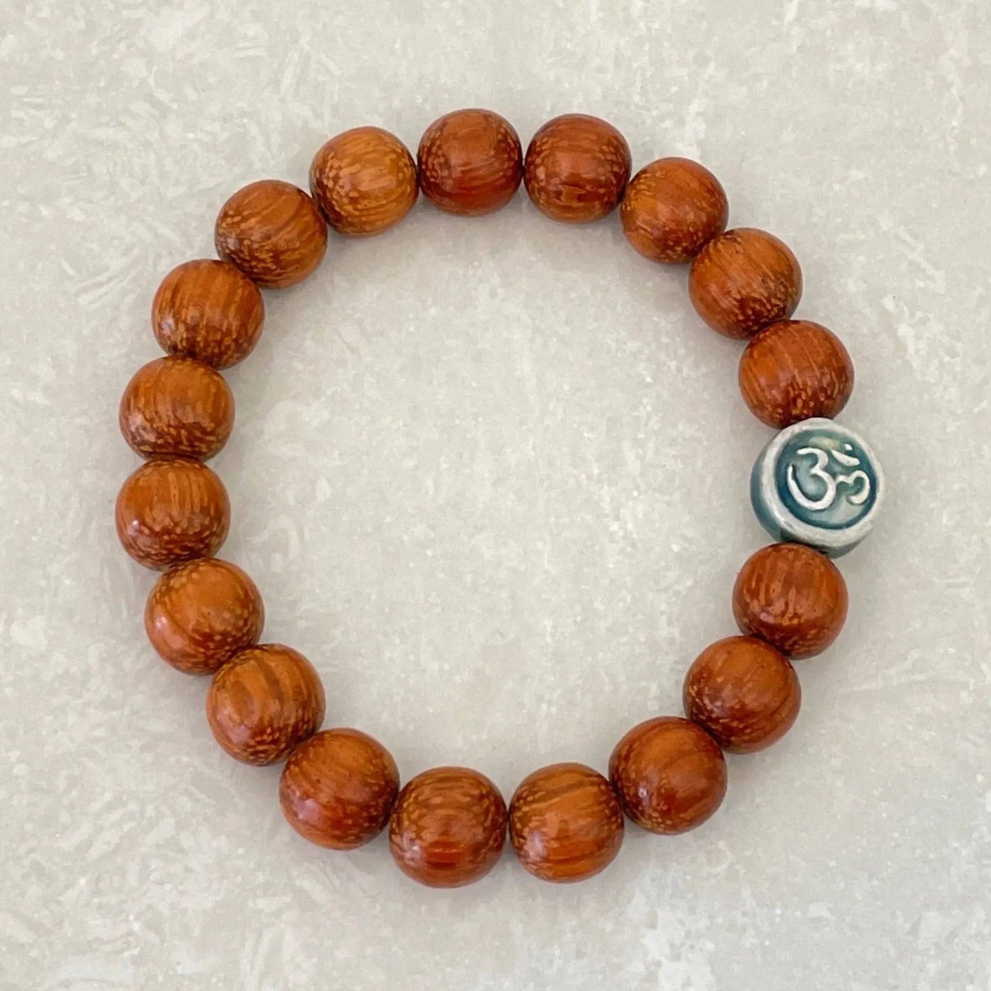Handmade Bayong wood bracelet with OM symbol charm - Uplift Beads