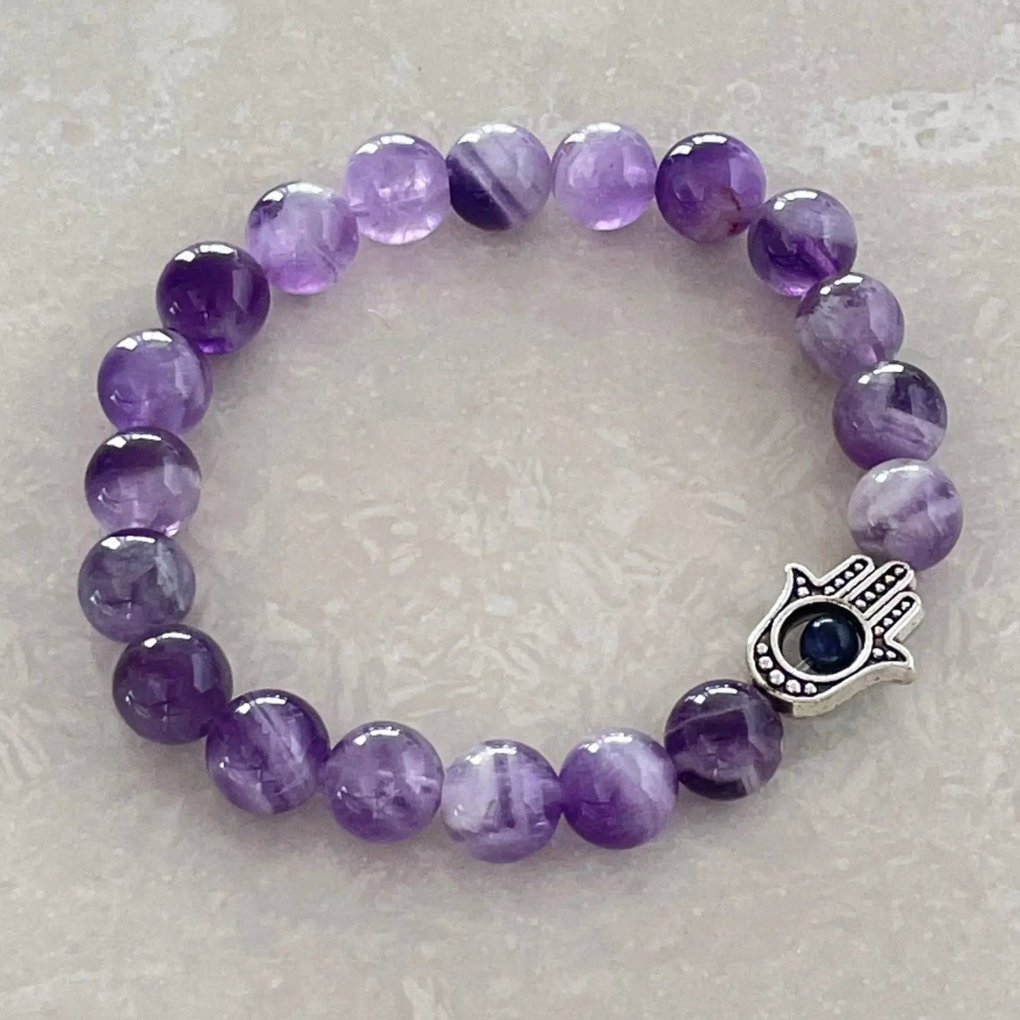 Genuine gemstone bracelet showcasing natural Chevron Amethyst patterns - Uplift Beads