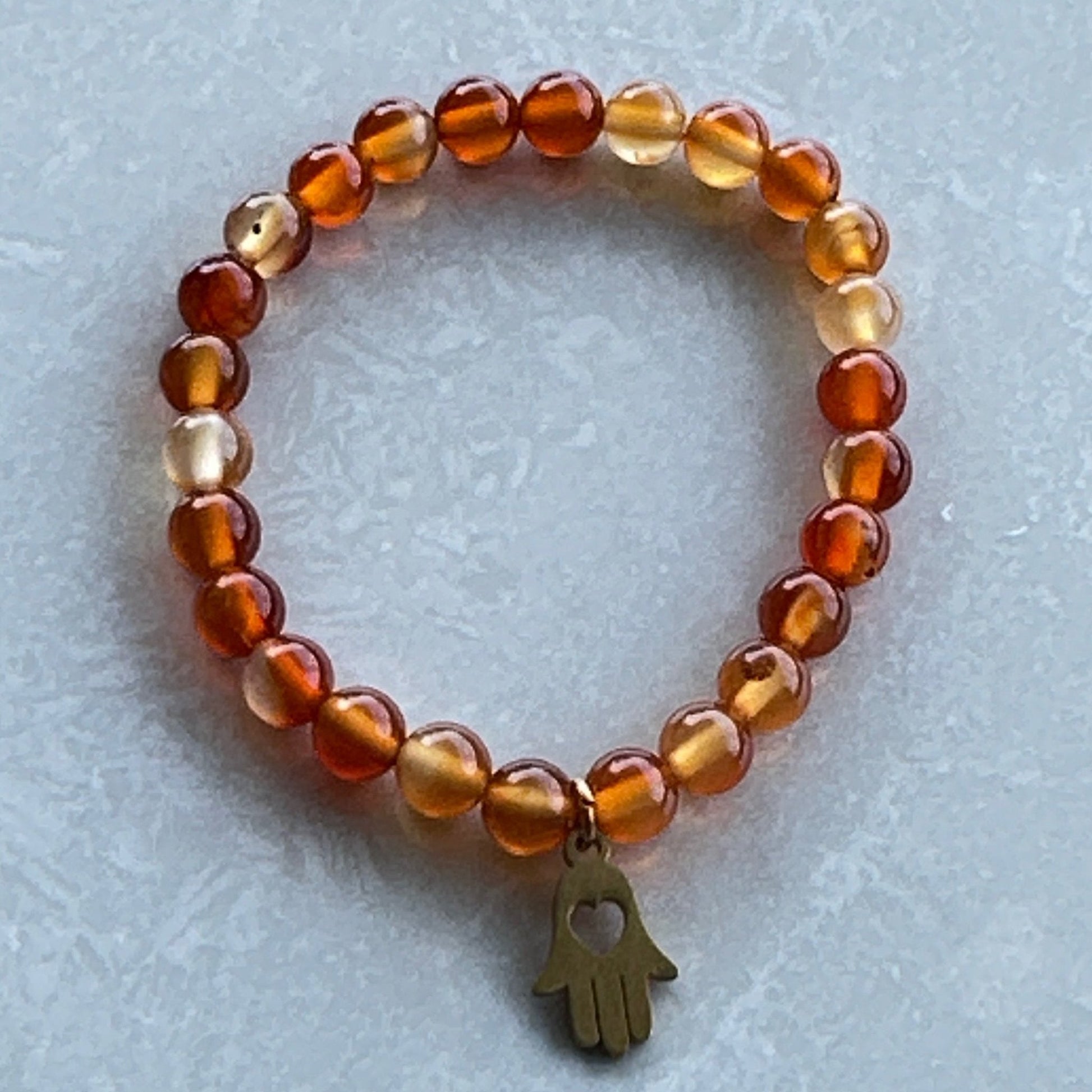 Carnelian stretch bracelet with warm sunset-inspired colors - Uplift Beads