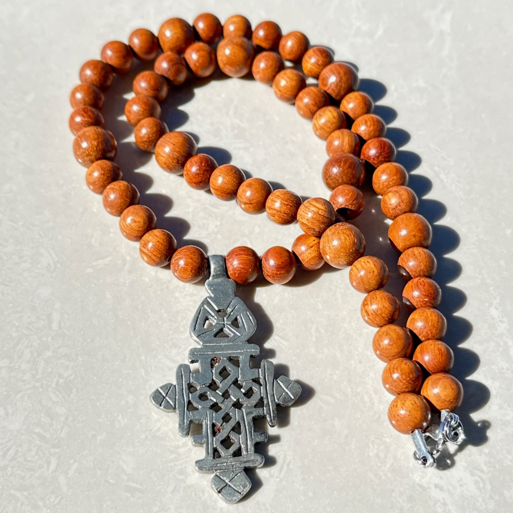 Handmade Ethiopian Cross Necklace featuring an intricate cross pendant - Uplift Beads