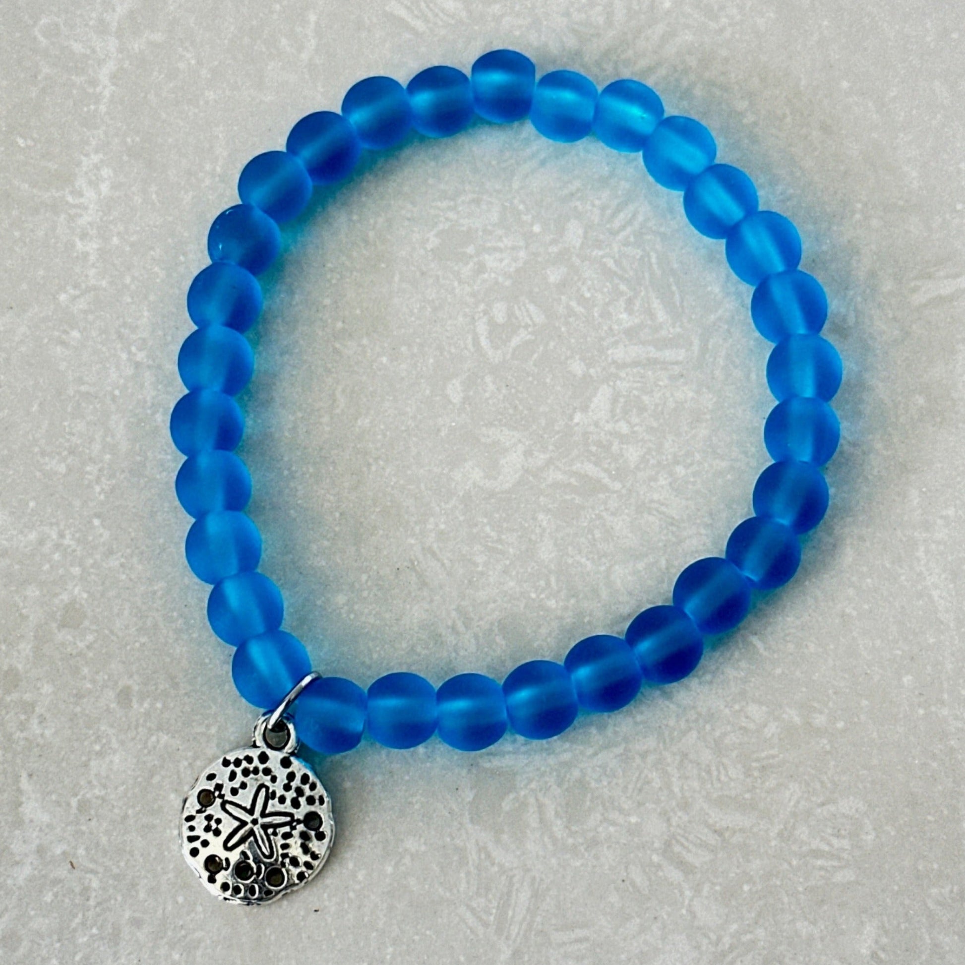 Handmade coastal bracelet with sand dollar charm - Uplift Beads