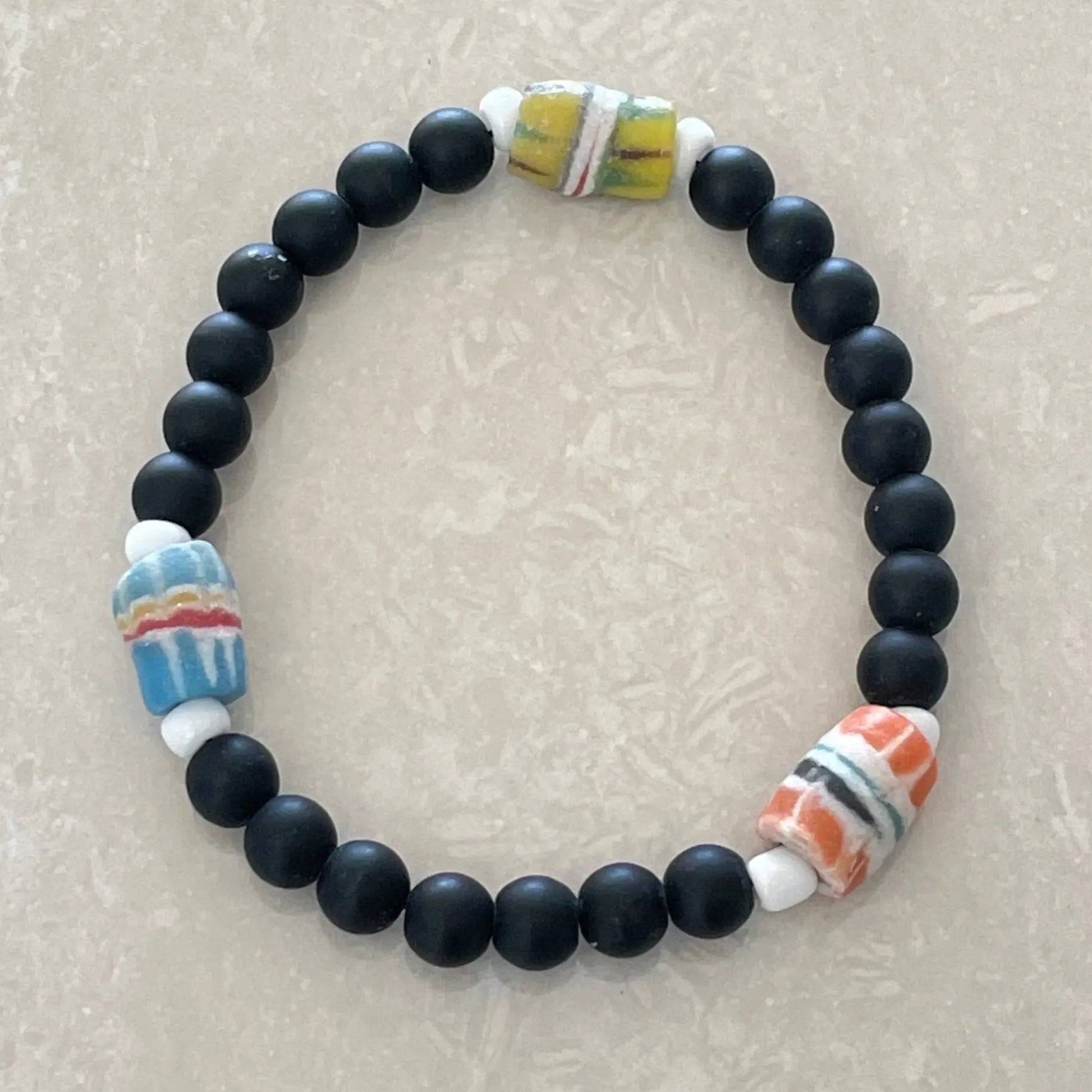 African Krobo Feather Bead Bracelet featuring authentic Ghanaian glass beads - Uplift Beads