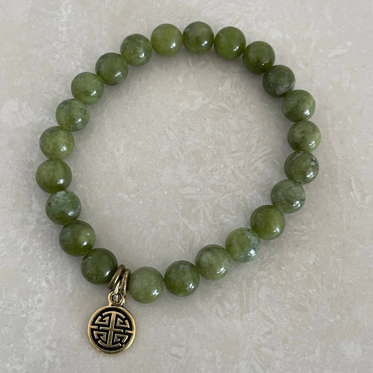 Natural jade gemstone bracelet symbolizing harmony and prosperity - Uplift Beads