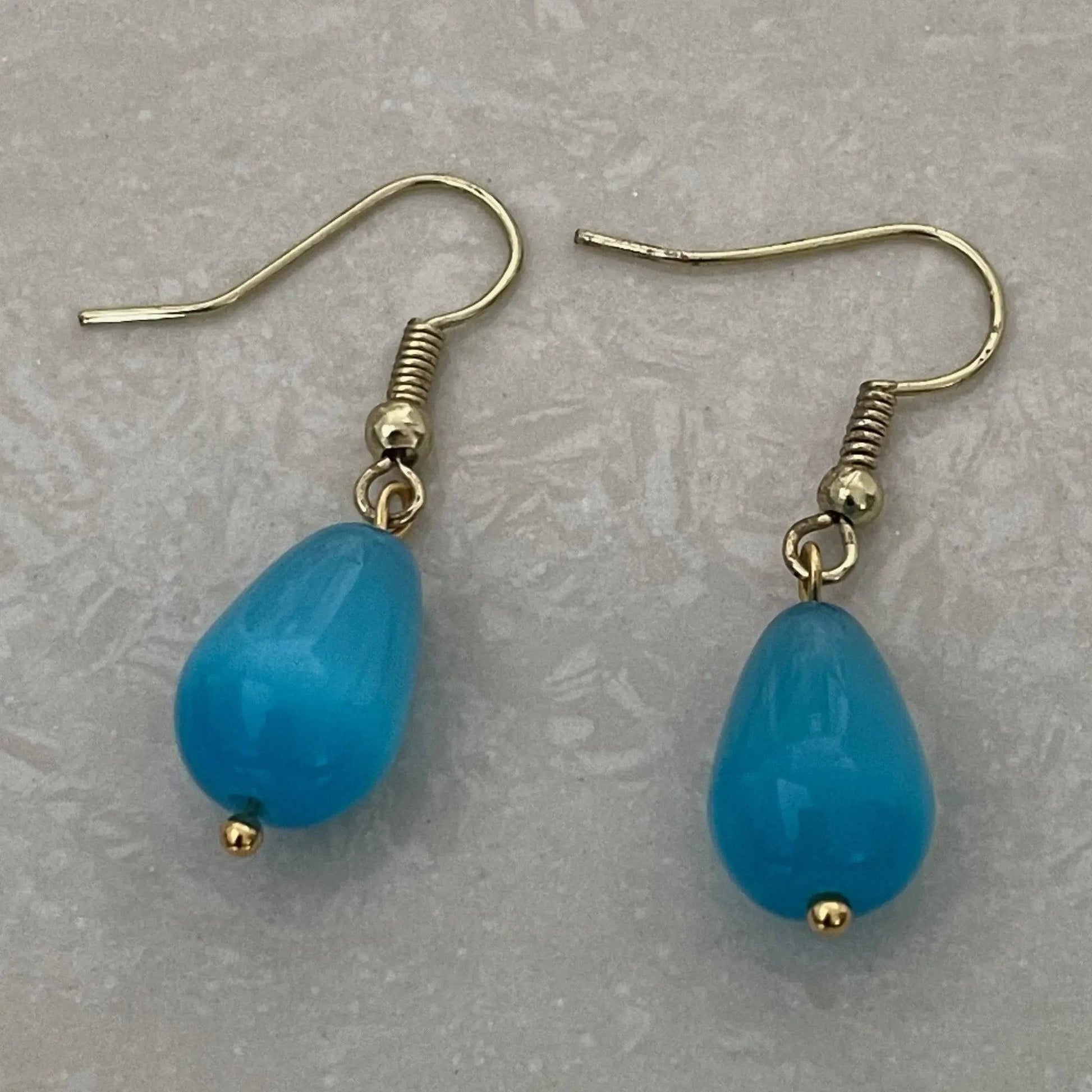 Elegant glass bead earrings showcasing Cat Eye shimmer - Uplift Beads