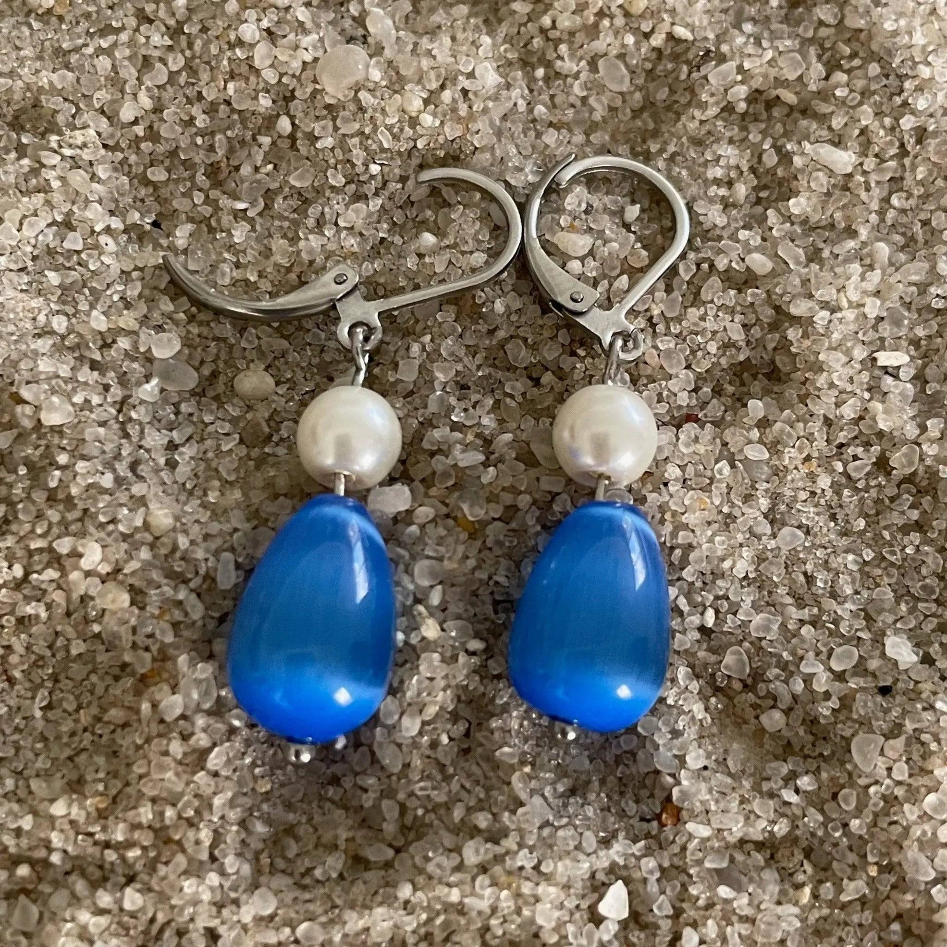 Elegant glass bead earrings showcasing Cat Eye shimmer - Uplift Beads
