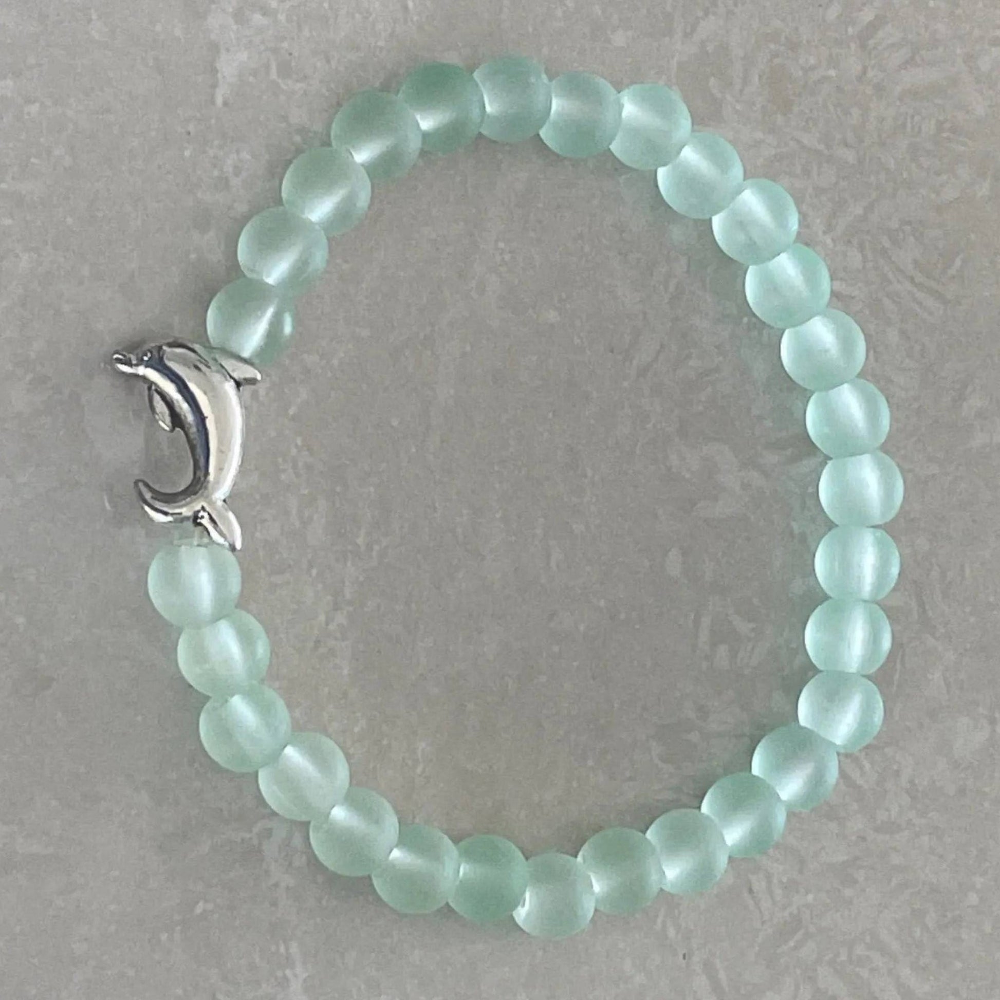 Dolphin charm bracelet with sea glass-inspired beads - Uplift Beads