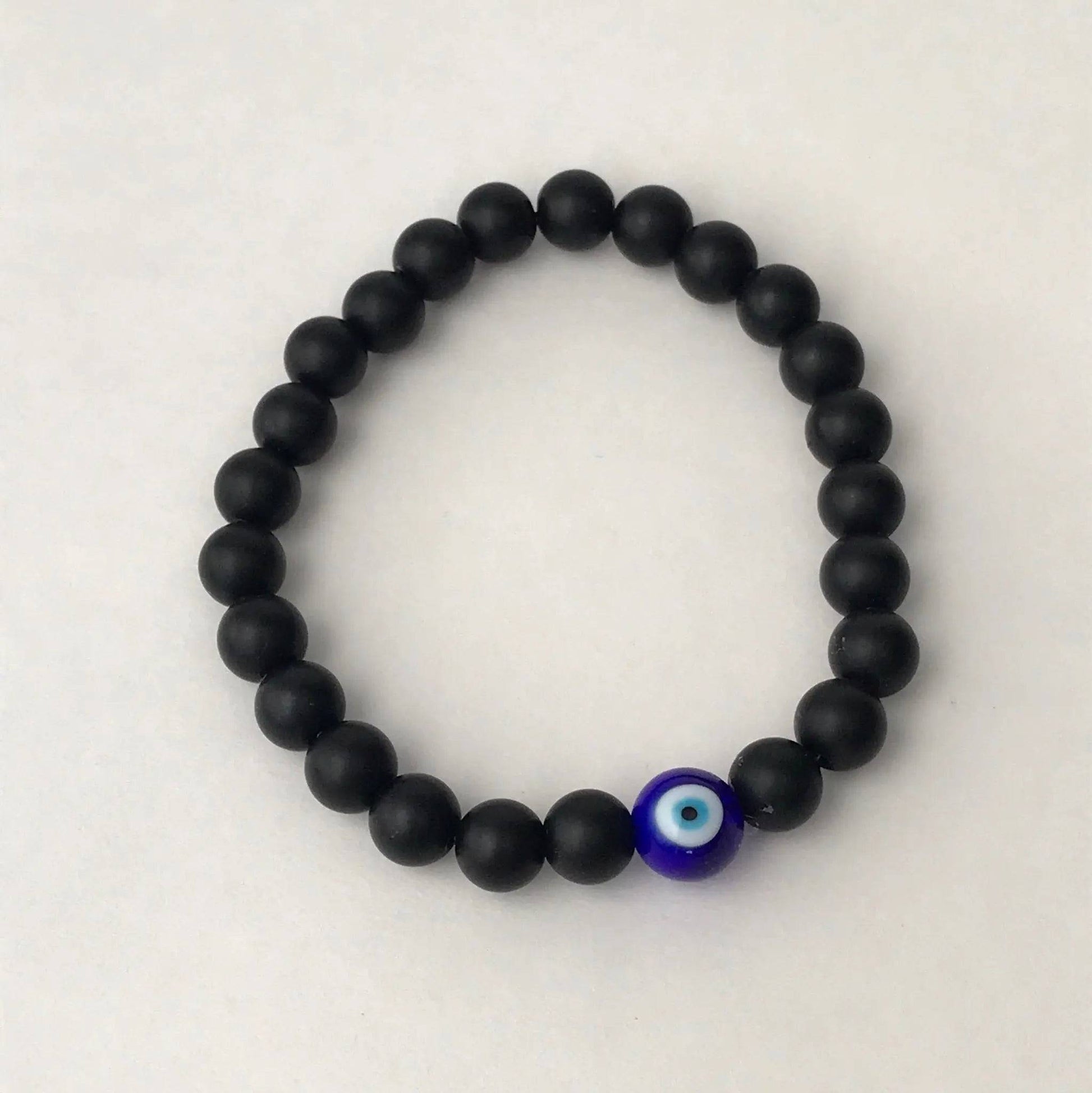 Handmade glass bead bracelet with Evil Eye centerpiece - Uplift Beads